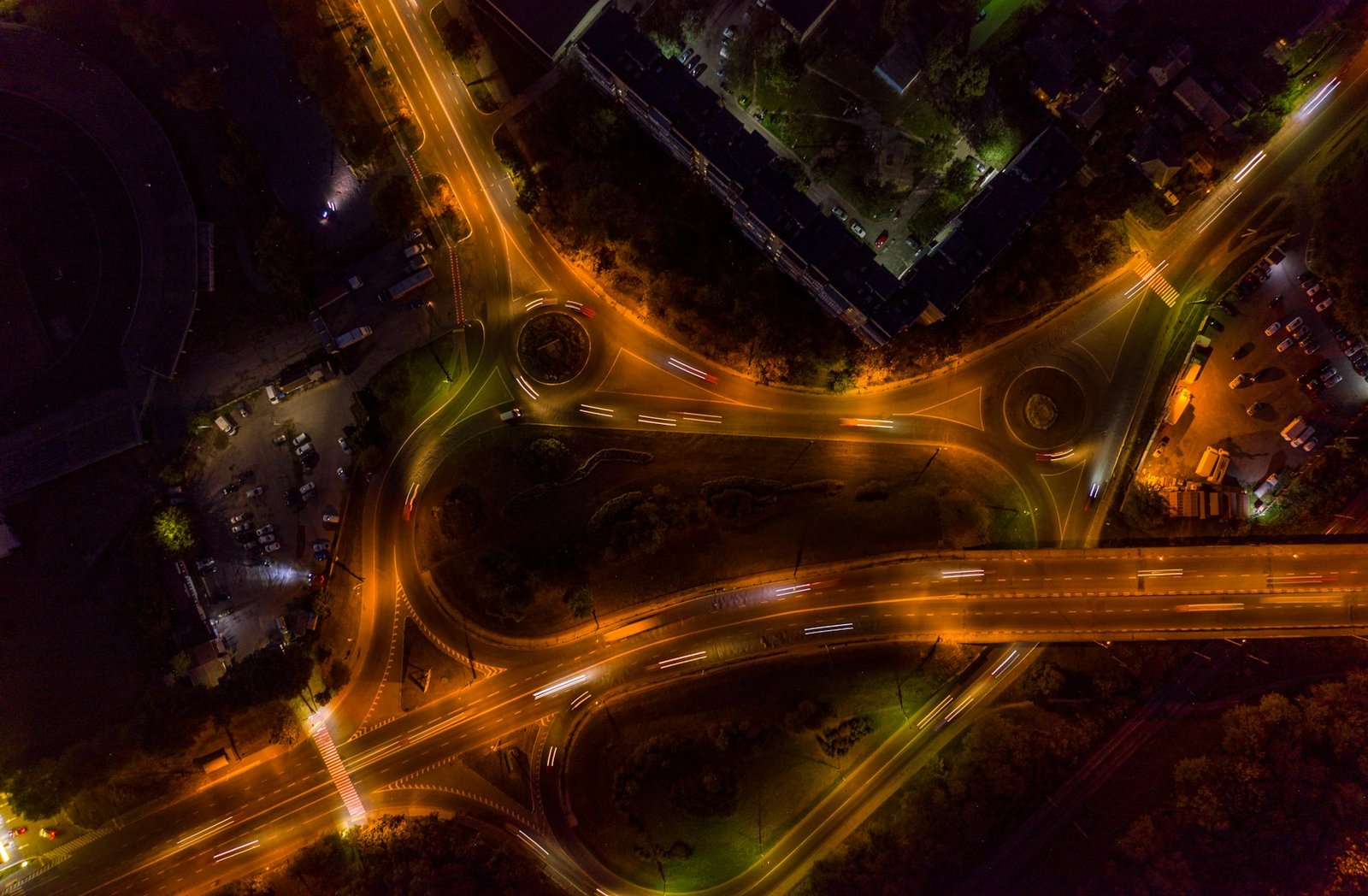 An aerial view of a highway interchange at night